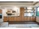 Open-concept living room with custom cabinetry, lighting, and hardwood floors at 500 Grigsby Ave, Holly Springs, NC 27540