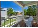 Relaxing covered balcony with white Adirondack chairs overlooking a peaceful street at 500 Spruce St, Durham, NC 27703