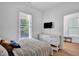 Inviting bedroom with neutral decor, large window, and modern furnishings at 500 Spruce St, Durham, NC 27703