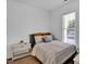 Cozy bedroom with ample natural light and comfortable furnishings at 500 Spruce St, Durham, NC 27703