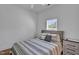 Clean and comfortable bedroom with a large window and neutral color palette at 500 Spruce St, Durham, NC 27703