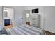 Well-lit bedroom showcasing an en suite bathroom and modern furnishings at 500 Spruce St, Durham, NC 27703
