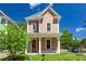 Lovely two-story home featuring a covered front porch, perfect for relaxing outdoors at 500 Spruce St, Durham, NC 27703