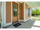 Inviting front entrance with a wooden door, a 'hello' mat, and well-maintained porch at 500 Spruce St, Durham, NC 27703