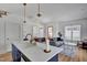 Modern kitchen with stainless steel appliances, a blue island, and stylish pendant lighting at 500 Spruce St, Durham, NC 27703