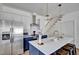 Well-equipped kitchen featuring stainless steel appliances, a spacious island, and modern finishes at 500 Spruce St, Durham, NC 27703
