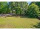 Spacious backyard with lush lawn, perfect for outdoor activities and relaxation at 5316 Tanglewood Pine Ln, Raleigh, NC 27610