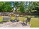 Relax in this backyard, which includes a built-in gas grill and a seating area on a concrete patio at 5316 Tanglewood Pine Ln, Raleigh, NC 27610