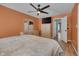 Large bedroom with lots of space, wood floors, a ceiling fan, and two windows at 5316 Tanglewood Pine Ln, Raleigh, NC 27610