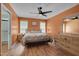 Spacious bedroom with a large bed, ceiling fan, and lots of natural light at 5316 Tanglewood Pine Ln, Raleigh, NC 27610