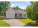 Charming single-story home featuring a well-maintained lawn, front porch, and a one-car garage at 5316 Tanglewood Pine Ln, Raleigh, NC 27610