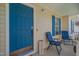 Inviting front porch with blue chairs and accents, offering a cozy welcome at 5316 Tanglewood Pine Ln, Raleigh, NC 27610