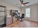 Home office features ample storage, a ceiling fan, and lots of natural light at 5316 Tanglewood Pine Ln, Raleigh, NC 27610
