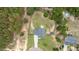 Aerial view of a house with a spacious backyard and surrounding trees at 576 Prairie Ln, Lillington, NC 27546