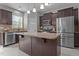 Modern kitchen featuring stainless steel appliances, granite countertops, and ample cabinet space at 576 Prairie Ln, Lillington, NC 27546