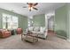 Spacious living room with neutral-toned walls, furniture, a ceiling fan, and an open layout to other rooms at 576 Prairie Ln, Lillington, NC 27546