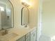 This bathroom features double sinks, and a tiled shower at 614 Tart Town Rd, Dunn, NC 28334