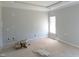 Cozy bedroom with a tray ceiling, awaiting your personal design touches at 614 Tart Town Rd, Dunn, NC 28334