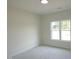 Bedroom featuring a large window, neutral paint, and simple lighting allowing for customization at 614 Tart Town Rd, Dunn, NC 28334