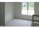 Bright bedroom features a large window providing ample natural light at 614 Tart Town Rd, Dunn, NC 28334
