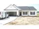 Charming single-story home featuring an attached garage, and classic curb appeal at 614 Tart Town Rd, Dunn, NC 28334