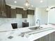 A kitchen with shaker cabinets, white counters, and a pendant lighting fixture at 614 Tart Town Rd, Dunn, NC 28334