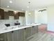 A kitchen with shaker cabinets, white counters, and a pendant lighting fixture at 614 Tart Town Rd, Dunn, NC 28334