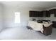 Spacious kitchen with central island, modern cabinets, and ample natural light at 614 Tart Town Rd, Dunn, NC 28334