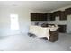 Spacious kitchen with central island, modern cabinets, and ample natural light at 614 Tart Town Rd, Dunn, NC 28334