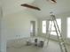 Bright living room featuring high ceilings with wooden beam accents and large windows at 614 Tart Town Rd, Dunn, NC 28334