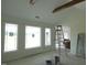 Bright living room featuring vaulted ceilings and large windows for natural light at 614 Tart Town Rd, Dunn, NC 28334