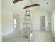 Bright living room featuring high vaulted ceilings with wooden beam accents at 614 Tart Town Rd, Dunn, NC 28334
