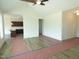 Open concept living area with luxury vinyl tile flooring, and vaulted ceiling with ceiling fan at 614 Tart Town Rd, Dunn, NC 28334