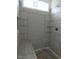 Modern bathroom shower with stylish tile design and glass shelving at 614 Tart Town Rd, Dunn, NC 28334