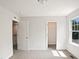 Bright bedroom with neutral walls, carpeted floor, closet, and lots of natural light from the window at 617 Hiddenbrook Dr, Durham, NC 27703