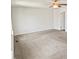 Large bedroom with carpet, a ceiling fan, and natural light from the window at 617 Hiddenbrook Dr, Durham, NC 27703