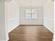 This dining room has hardwood floors and a large window, perfect for Gathering gatherings at 617 Hiddenbrook Dr, Durham, NC 27703