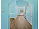 Hallway with staircase and entry leading to the front door providing a warm and inviting welcome at 617 Hiddenbrook Dr, Durham, NC 27703