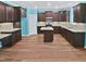 Spacious kitchen featuring hardwood floors, granite countertops, ample lighting, and lots of dark wood cabinetry at 617 Hiddenbrook Dr, Durham, NC 27703