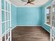 Inviting room featuring hardwood floors, a ceiling fan, and bright light from the window at 617 Hiddenbrook Dr, Durham, NC 27703