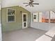 Relaxing screened-in porch with fan and views of the private fenced-in backyard at 617 Hiddenbrook Dr, Durham, NC 27703
