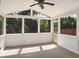 Bright screened-in porch with ceiling fan and plenty of natural light at 617 Hiddenbrook Dr, Durham, NC 27703