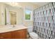 Bathroom featuring a vanity with sink, toilet, and a shower with a patterned curtain at 634 Cotton Brook Dr, Fuquay Varina, NC 27526