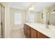 Bright bathroom featuring a double sink vanity, shower, tub, and neutral tiling at 634 Cotton Brook Dr, Fuquay Varina, NC 27526