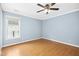 Bedroom featuring a window with backyard view at 634 Cotton Brook Dr, Fuquay Varina, NC 27526