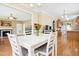 Bright dining area leading into living room and kitchen, with natural light and hardwood floors at 634 Cotton Brook Dr, Fuquay Varina, NC 27526
