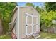 This outdoor storage shed features a double-door entry and is built on a red brick foundation at 634 Cotton Brook Dr, Fuquay Varina, NC 27526