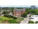 A charming brick building with a manicured lawn and lots of surrounding trees at 710 Independence Pl # 103, Raleigh, NC 27603