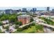 Aerial view shows the building in a cityscape with greenery and buildings at 710 Independence Pl # 103, Raleigh, NC 27603