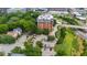 Overhead view of a brick building with surrounding trees and a parking lot at 710 Independence Pl # 103, Raleigh, NC 27603